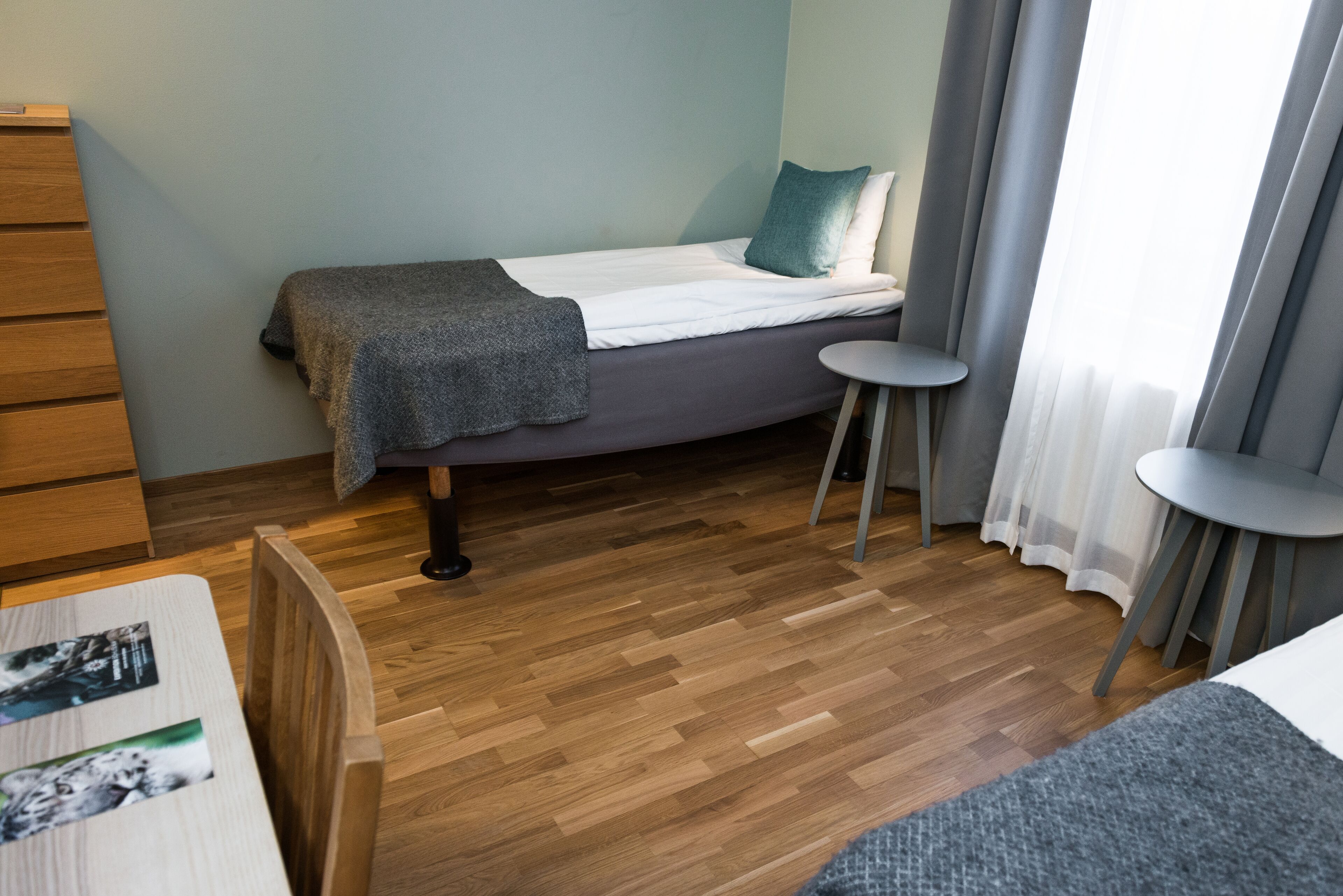 basic twin room | pillow-top beds, desk, laptop workspace, blackout curtains