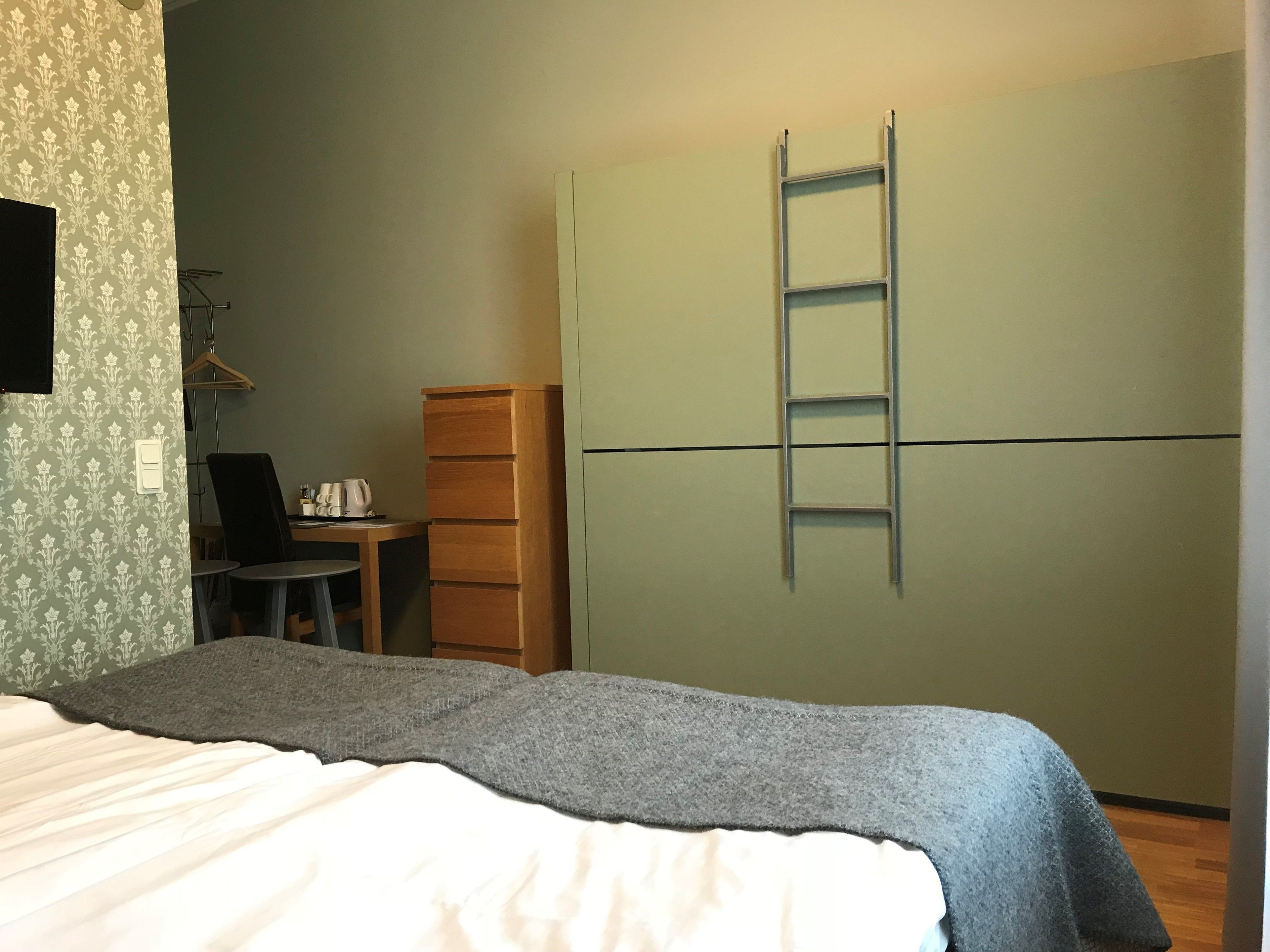 pillow-top beds, desk, laptop workspace, blackout curtains