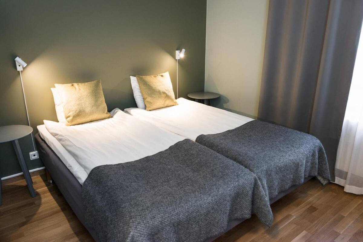 basic double room | pillow-top beds, desk, laptop workspace, blackout curtains