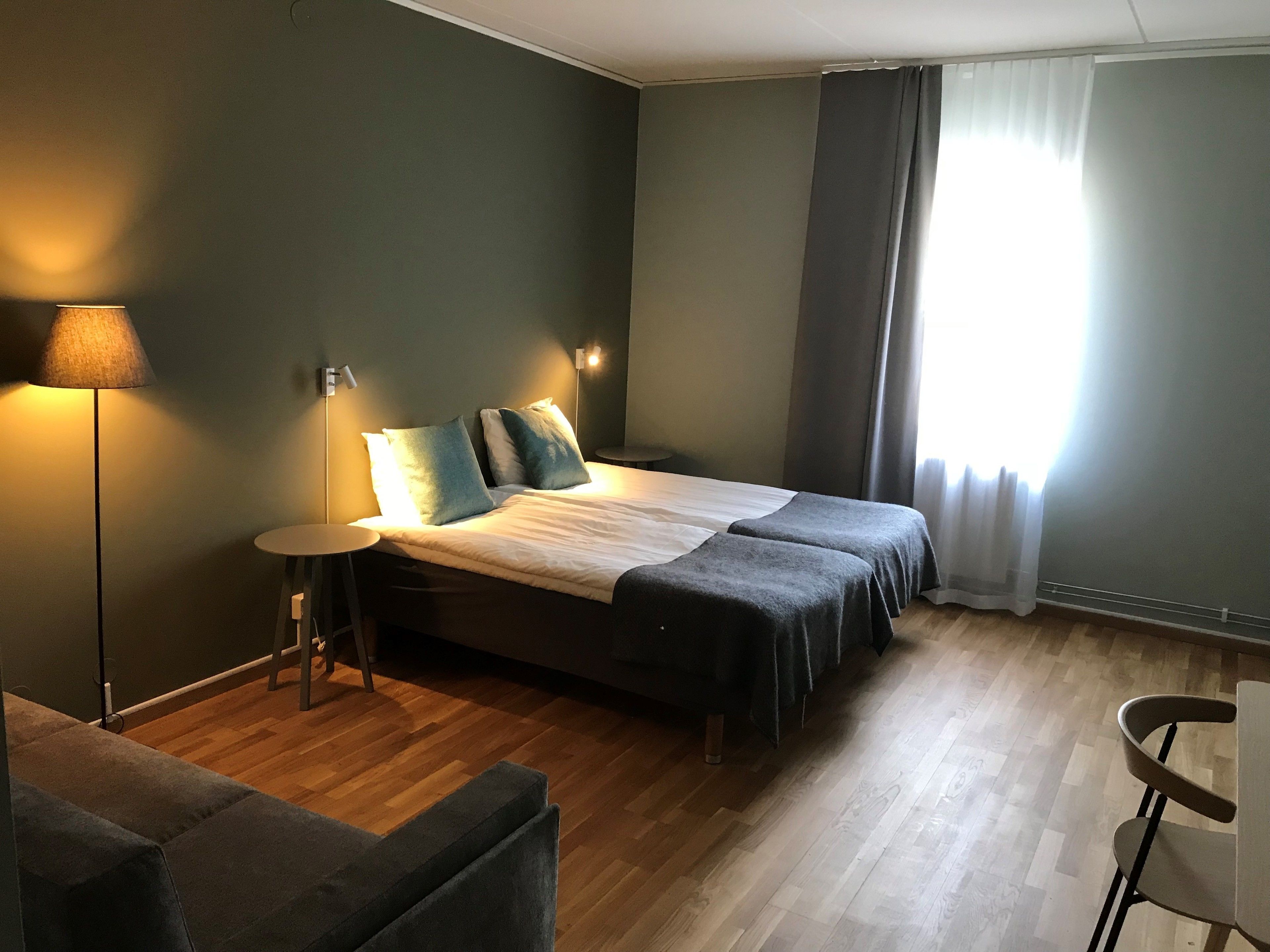 basic double room | pillow-top beds, desk, laptop workspace, blackout curtains