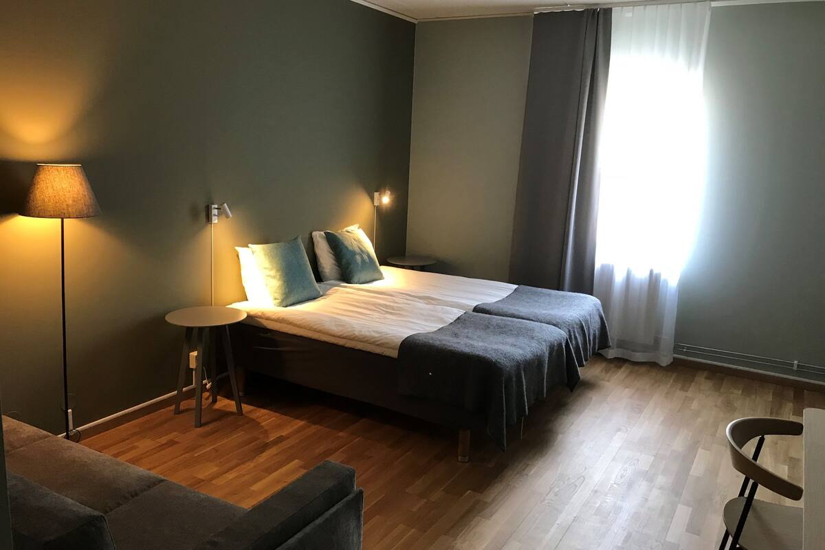 basic double room | pillow-top beds, desk, laptop workspace, blackout curtains