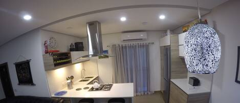 Deluxe Apartment, 2 Bedrooms, Partial Sea View | Living room | Flat-screen TV