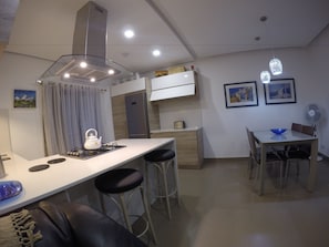 Deluxe Apartment, 2 Bedrooms, Partial Sea View | Private kitchen | Fridge, microwave, oven, stovetop