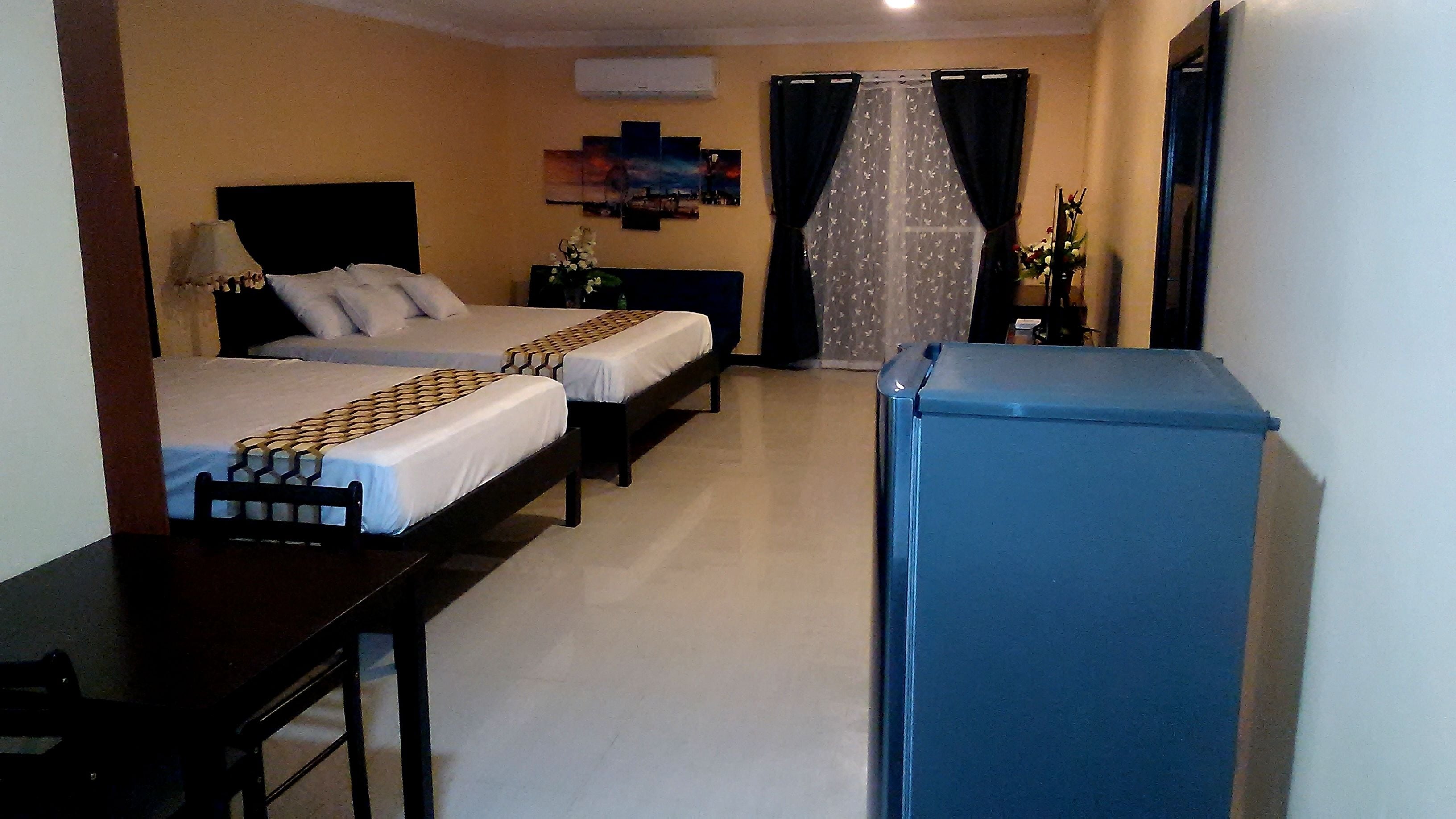 family double room, multiple beds, kitchenette, pool view | 1 bedroom, premium bedding, individually decorated