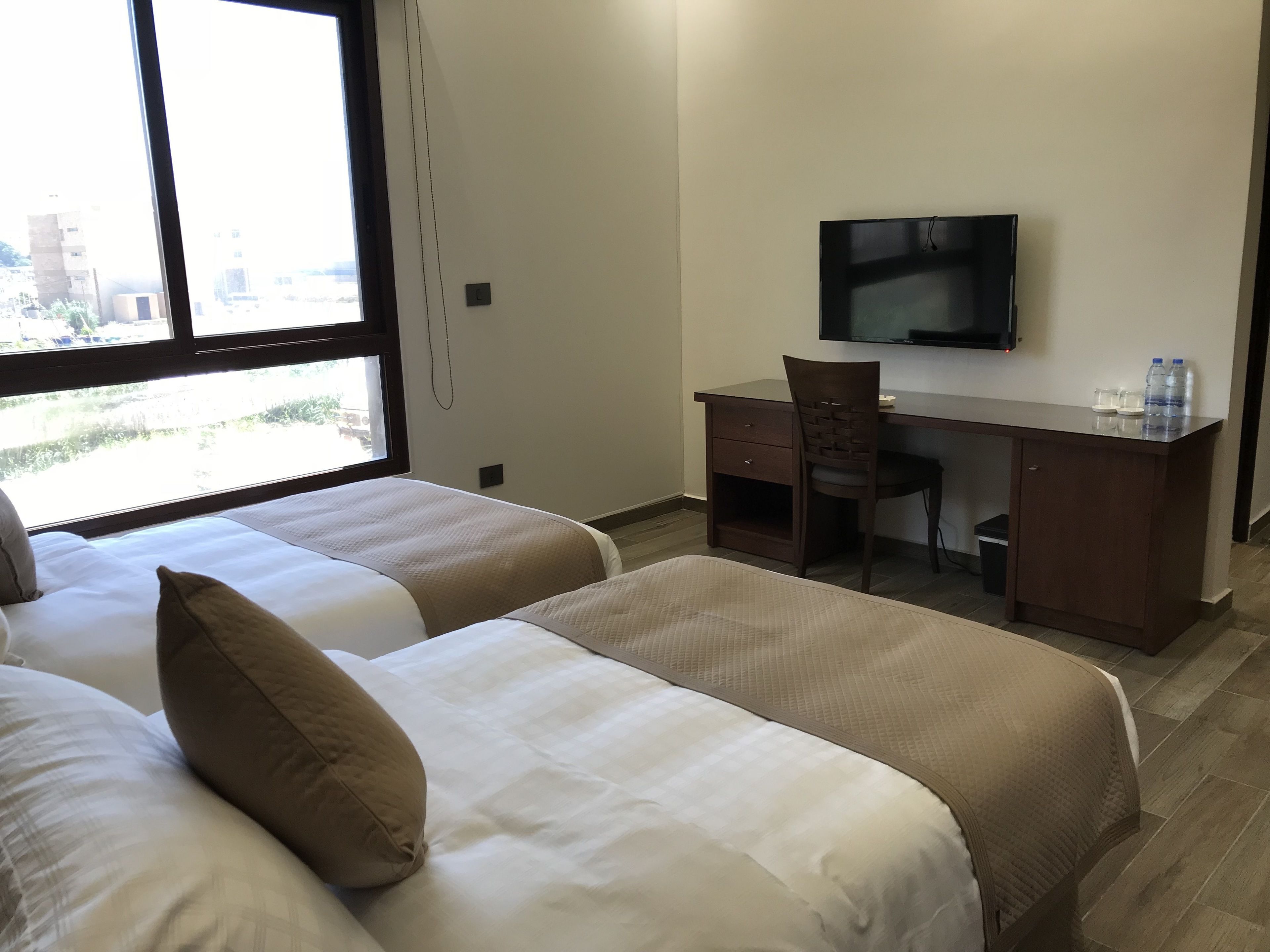 deluxe twin room, 2 single beds, partial sea view | premium bedding, minibar, in-room safe, desk