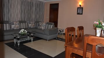 Basic Apartment, 2 Bedrooms, Balcony | Living area | Flat-screen TV, fireplace