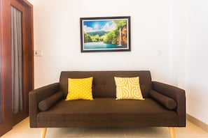 Departamento Deluxe, 1 habitación | Sala de estar | Smart TV 