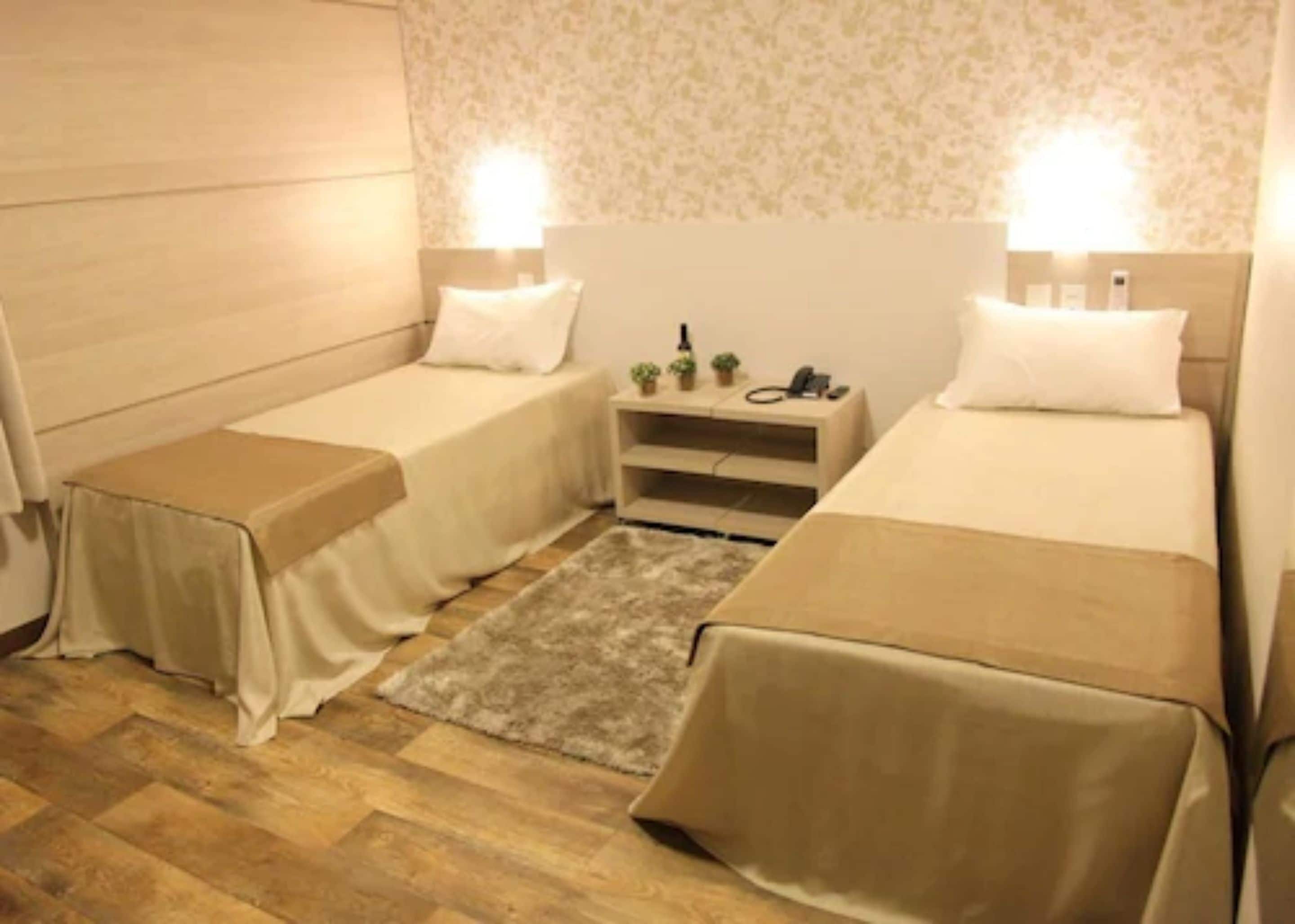 standard double or twin room | minibar, in-room safe, desk, blackout curtains