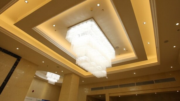 A hotel interior with a modern ceiling design, recessed lighting, and a prominent chandelier. - GreenTree Inn Suqian Suyang South ShangHai Rd Darunfa Hotel (Suqian)