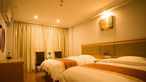 A hotel room with two beds, a desk, and a chair. - GreenTree Inn HuaiAn KangJian W Road XiAn Road Hotel (Huai'an)