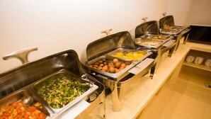 A buffet line with various food items including pasta, salads, and baked goods. - GreenTree Inn HuaiAn KangJian W Road XiAn Road Hotel (Huai'an)