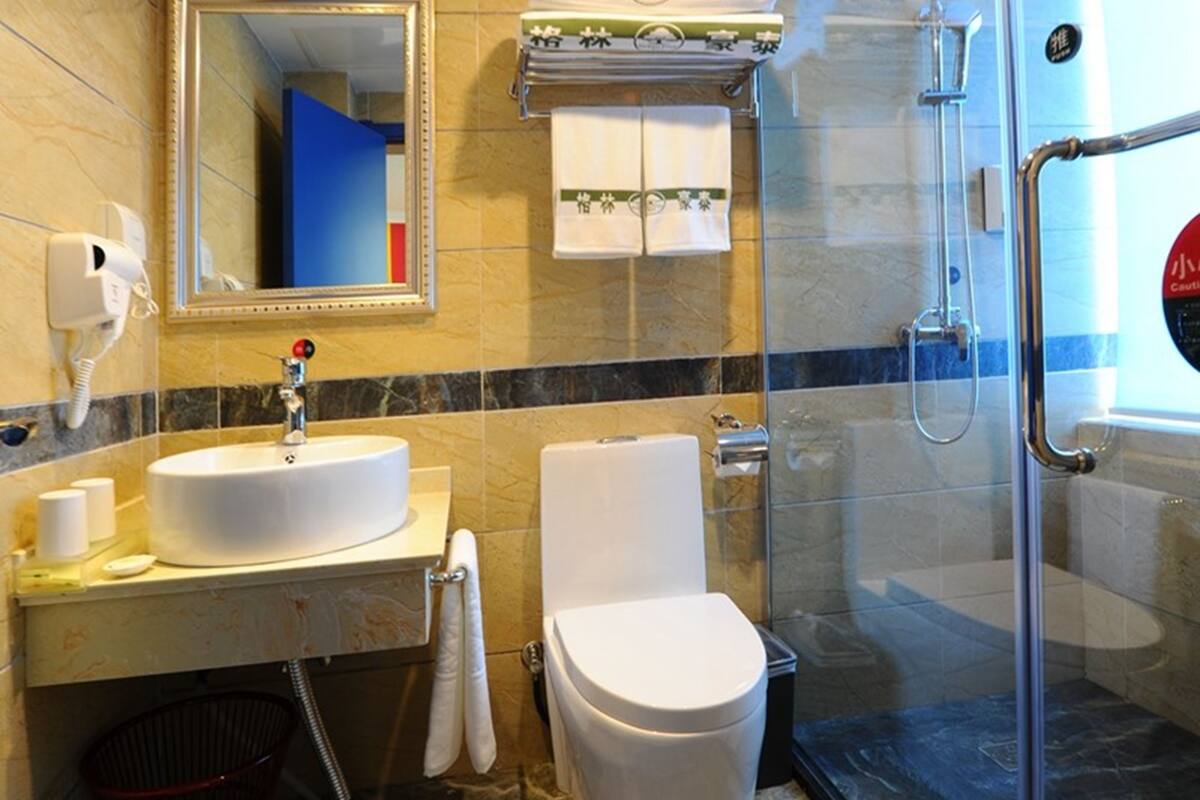 Shower, free toiletries, hair dryer, slippers