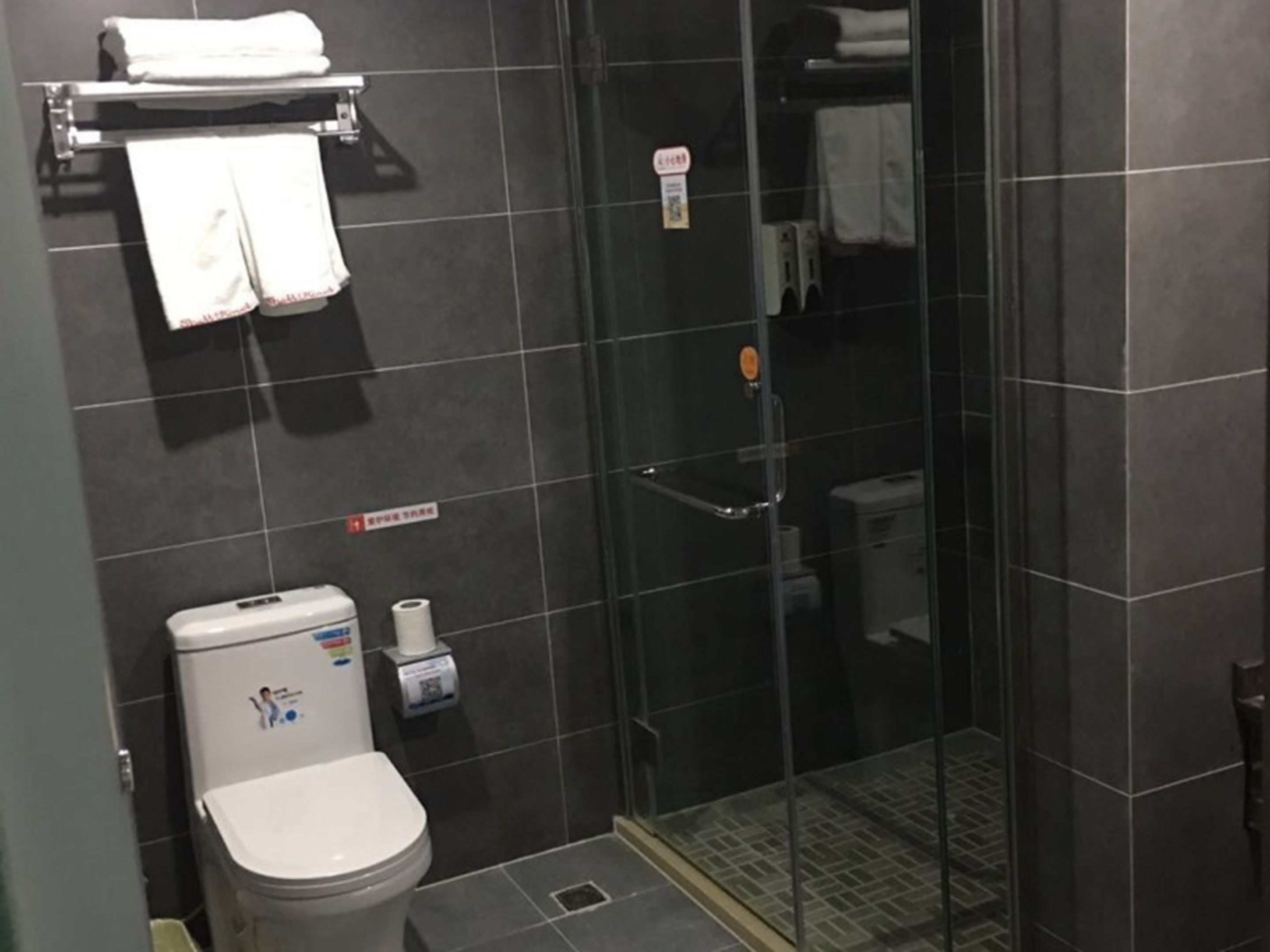 Shower, free toiletries, hair dryer, slippers