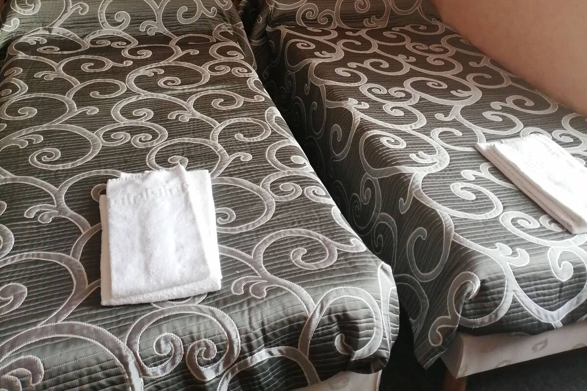 Premium bedding, blackout curtains, iron/ironing board, free WiFi