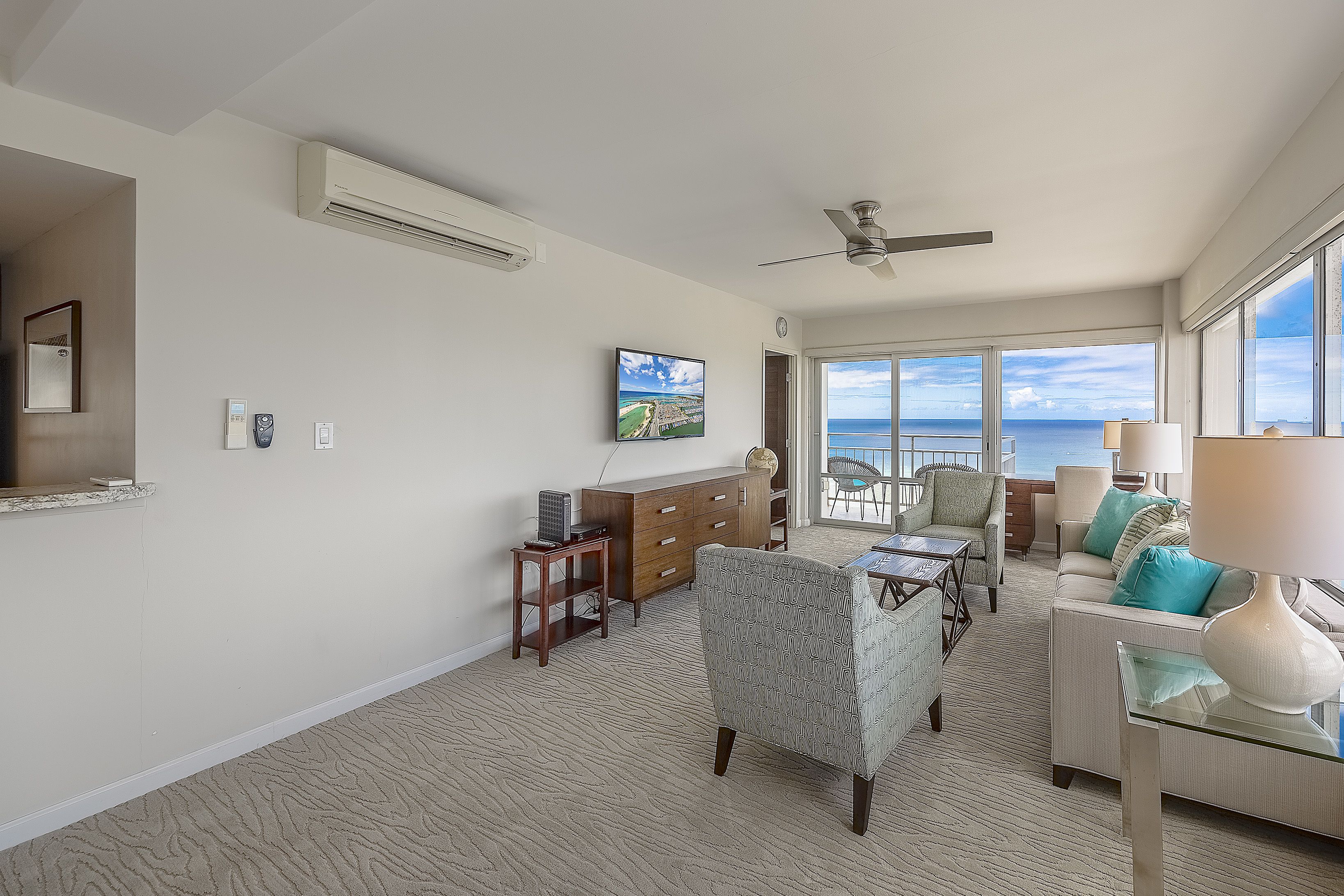 comfort room, multiple beds, ocean view, beachside (24262343) | living area | flat-screen tv