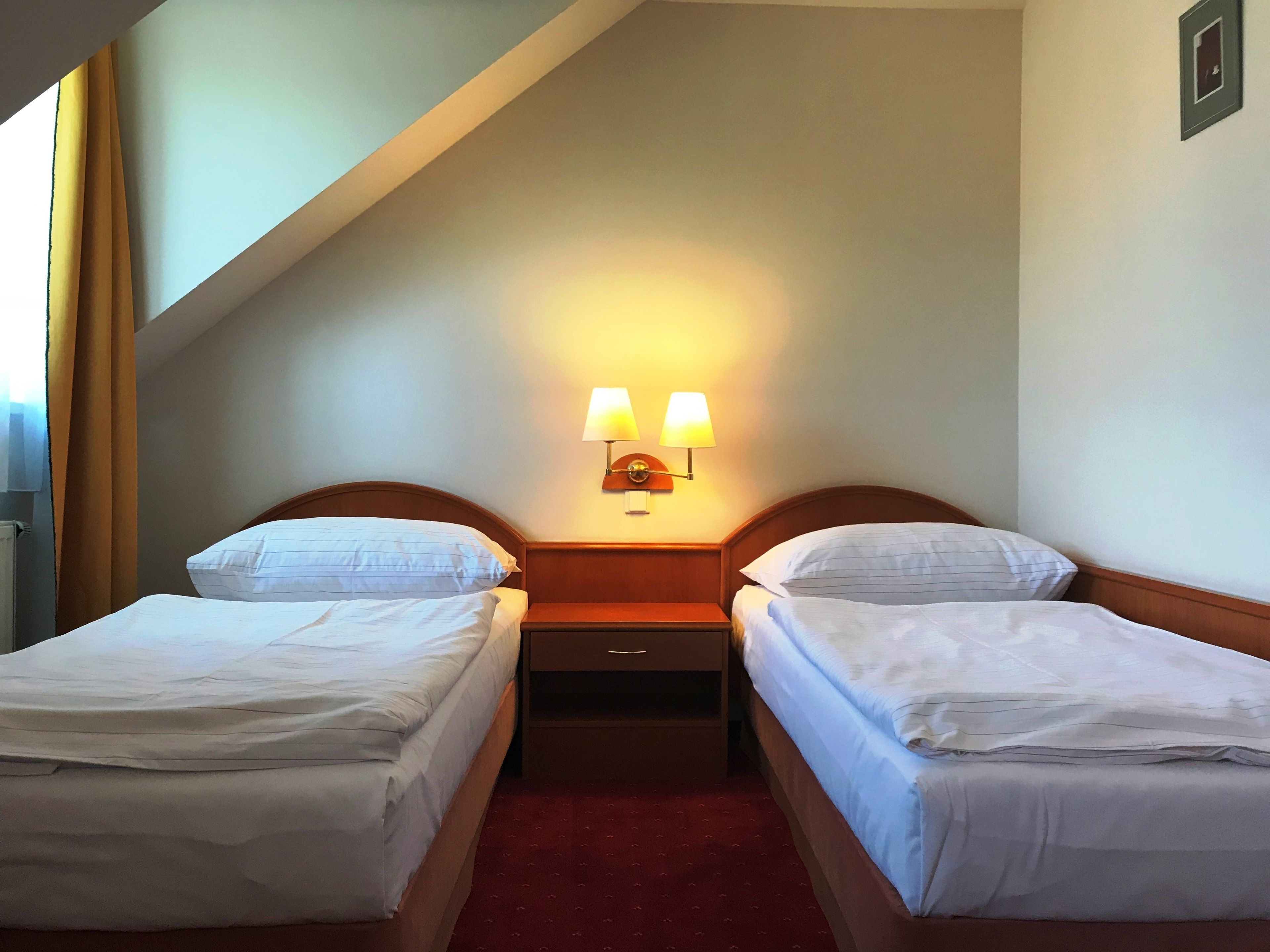 standard twin room | in-room safe, desk, blackout curtains, iron/ironing board