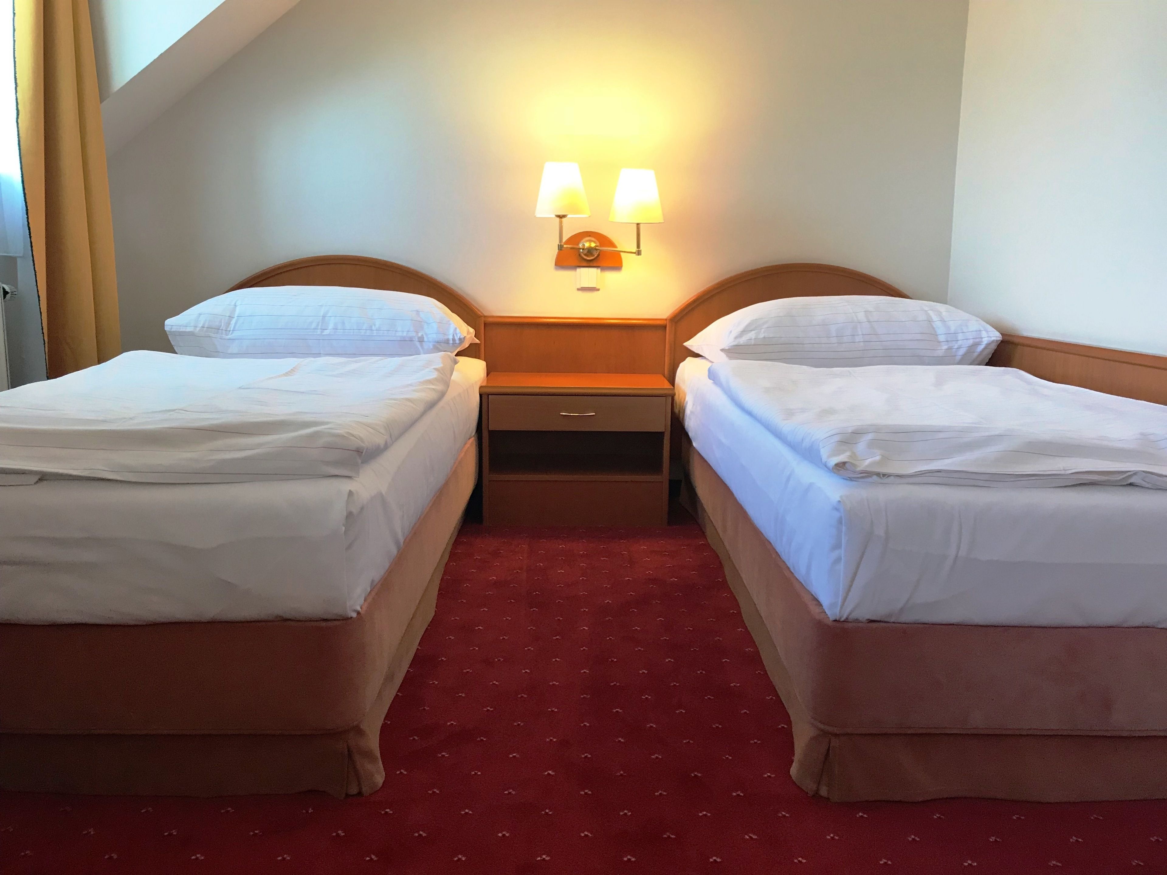 standard twin room | in-room safe, desk, blackout curtains, iron/ironing board