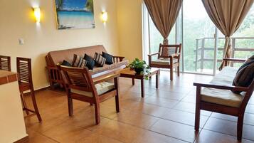 Premium Apartment, 1 Bedroom, Balcony, City View | Living room | 32-inch Smart TV with digital channels, TV, Netflix