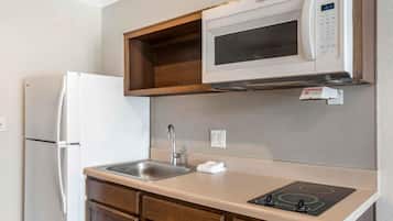 Full-size fridge, microwave, stovetop, freezer