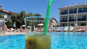Seasonal outdoor pool, open 9:00 AM to 7:00 PM, pool loungers