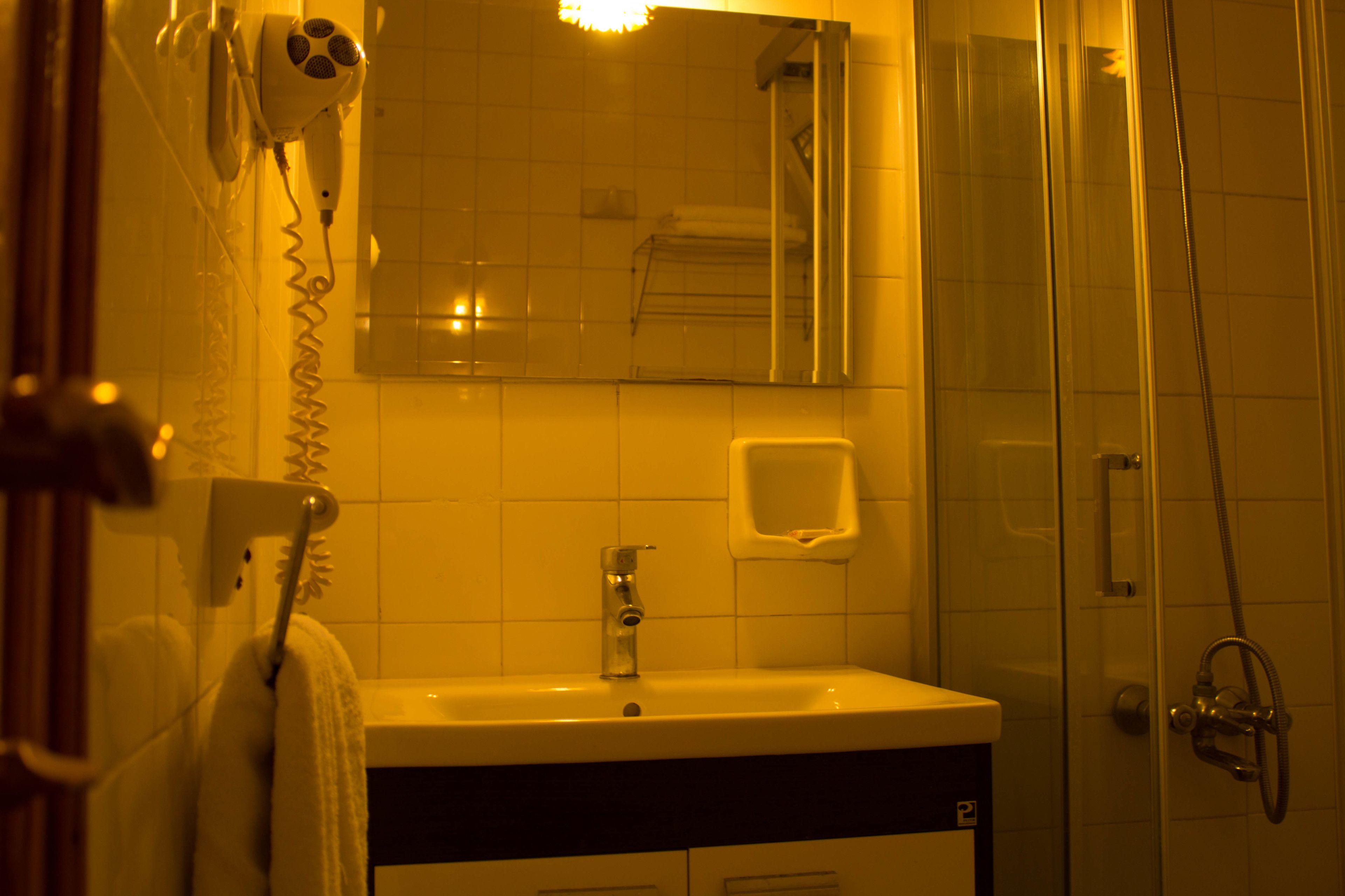 family suite | bathroom | shower, slippers, towels