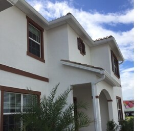Stylish two-story building with a welcoming entrance and charming facade.