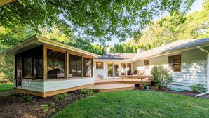 A two-story house with a covered patio and a separate garage. - PRIVATE HEATED POOL and PET FRIENDLY! (3 Nt Min!) (Michiana Shores)