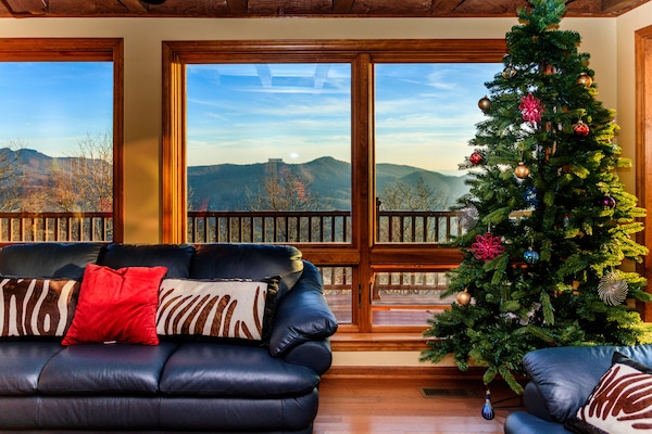 Living room with grandfather mountain and sugar ski resort view.