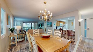Enjoy meals in this dining area with a large table and comfortable seating for all.