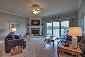 TV, fireplace, books - Lakefront Ozark Condo w/ Balcony & Seasonal Pool! (Camdenton)