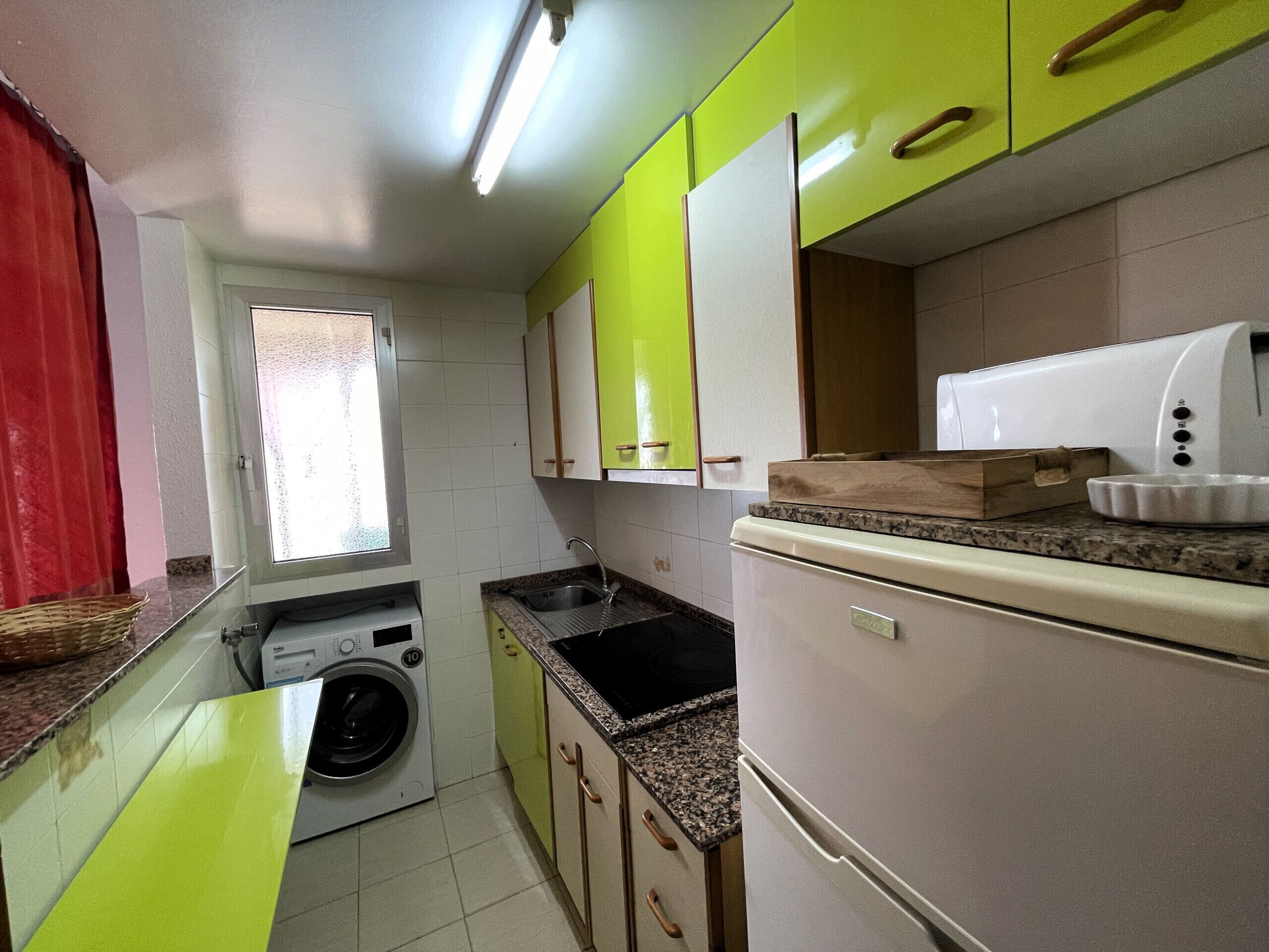 Fridge, microwave, coffee/tea maker, cookware/dishes/utensils