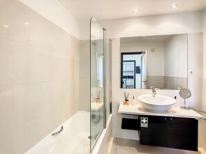 Bathtub, hair dryer, towels