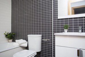 Bathtub, hair dryer, towels