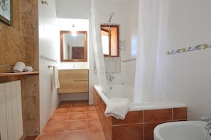 Bathtub, hair dryer, towels