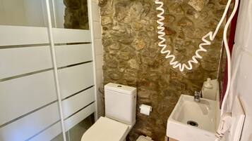 Shower, hair dryer, towels, toilet paper