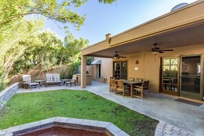 A covered patio with outdoor furniture, a grill, and a swimming pool. - Dual Master Suite • Pool • Talking Stick• Sleeps 6 - Self Check In (Scottsdale)