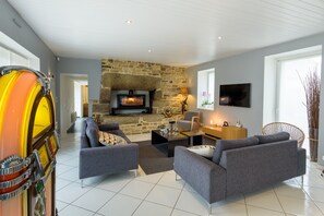 Smart TV, fireplace, table football, books