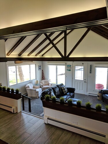 Hamptons style Lake house on Sunset point. With water on both the east and west!