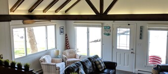 Hamptons style Lake house on Sunset point. With water on both the east and west!