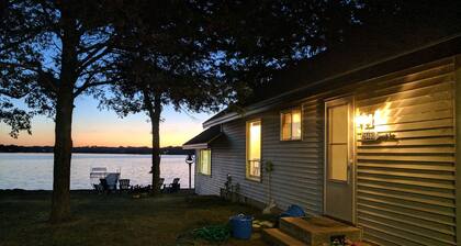Hamptons style Lake house on Sunset point. With water on both the east and west!
