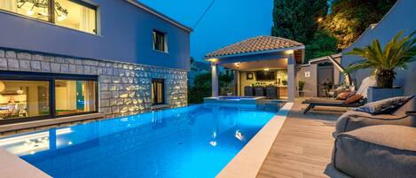 Outdoor pool, a heated pool, pool loungers
