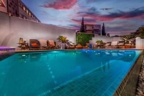 Outdoor pool, a heated pool, pool loungers
