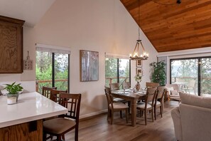 Bright dining area under vaulted ceilings