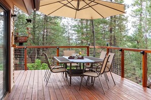 Covered deck dining with mountain views