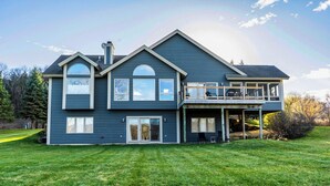 A two-story house with a large front lawn, a covered porch, and a garage. - 3 Bedroom, 3 1/2 bath house in The Galena Territory. (Galena)