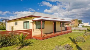 A single-story house with a flat roof, a covered porch, and a fenced yard. - Bella Vista - Apollo Bay (Apollo Bay)