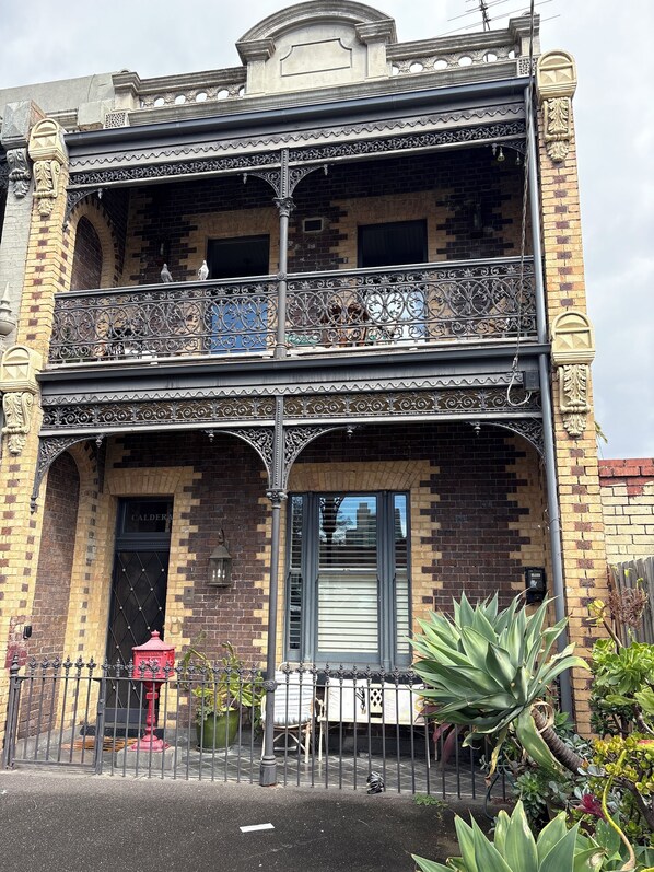A two-story building with ornate iron balconies and a brick facade. - South Melbourne Terrace on Emerald Hill | Luxe Stay, Parking, Walk to CBD & More (South Melbourne)