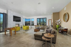 Smart TV, fireplace, table football, books