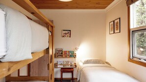A cozy room with bunk beds, a small desk with books, and a window with a view. - Mandala Bruny Island, waterfront, near Restaurant (Alonnah)