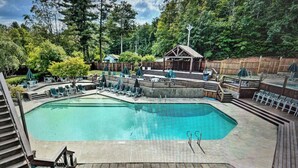 A swimming pool with lounge chairs and a covered seating area. - In the Estates, close to Owl's Nest, new kitchen, amazing views, minutes off I93 (Thornton)